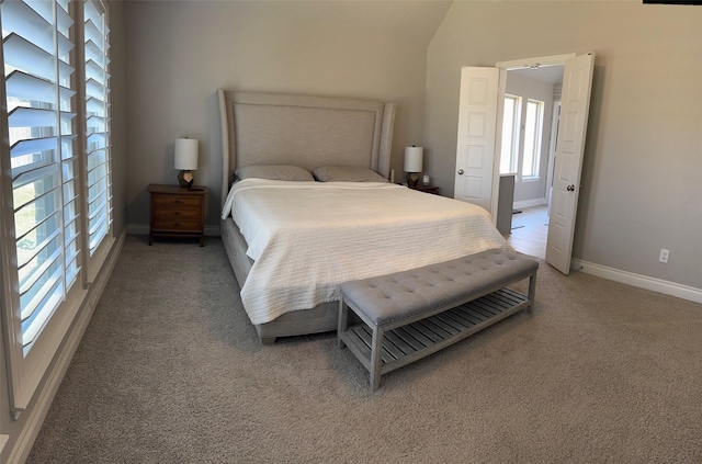 7010 Goldstrum Way, Katy, TX 77493 - bedroom featuring light colored carpet, baseboards, and vaulted ceiling