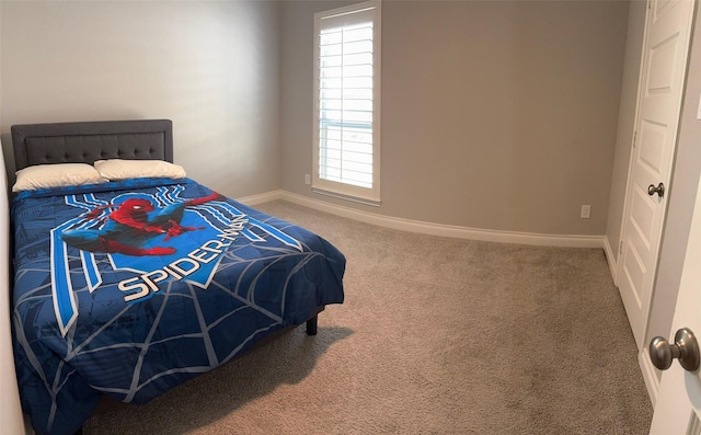 7010 Goldstrum Way, Katy, TX 77493 - carpeted bedroom featuring baseboards and multiple windows