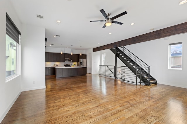 910 W 19th St Unit A, Houston, TX 77008 - unfurnished living room featuring light wood-style flooring, stairway, recessed lighting, and a ceiling fan