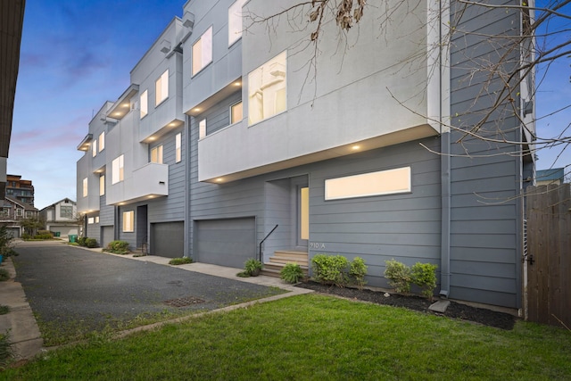 910 W 19th St Unit A, Houston, TX 77008 - view of building exterior featuring an attached garage and driveway