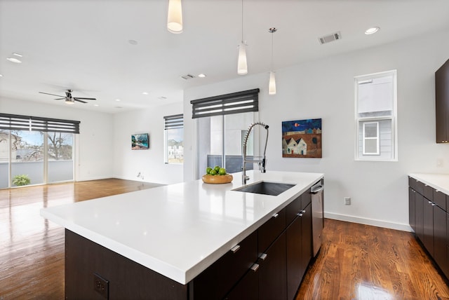 910 W 19th St Unit A, Houston, TX 77008 - kitchen with a sink, dark wood-type flooring, light countertops, dishwasher, and ceiling fan