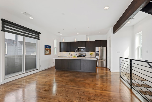 910 W 19th St Unit A, Houston, TX 77008 - kitchen featuring stainless steel appliances, light countertops, a kitchen island with sink, healthy amount of natural light, and recessed lighting