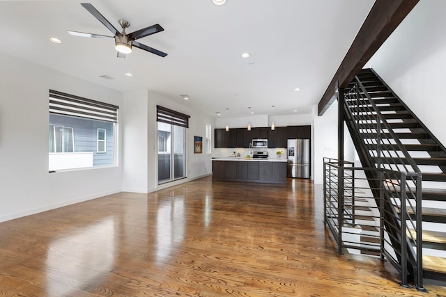 910 W 19th St Unit A, Houston, TX 77008 - unfurnished living room with stairs, light wood-style floors, a ceiling fan, recessed lighting, and baseboards