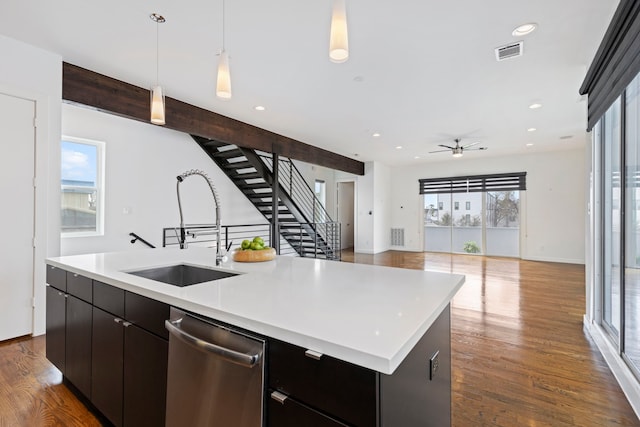 910 W 19th St Unit A, Houston, TX 77008 - kitchen featuring a sink, stainless steel dishwasher, open floor plan, an island with sink, and light countertops