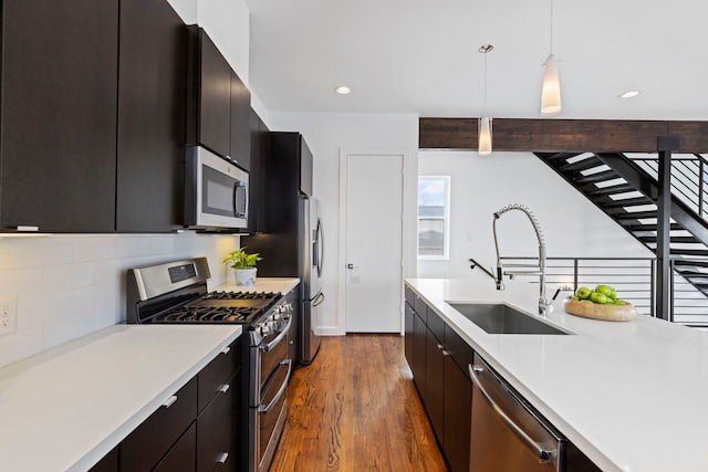 910 W 19th St Unit A, Houston, TX 77008 - kitchen with stainless steel appliances, light countertops, decorative light fixtures, modern cabinets, and recessed lighting
