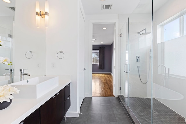 910 W 19th St Unit A, Houston, TX 77008 - bathroom with a shower stall, vanity, tile patterned flooring, baseboards, and recessed lighting