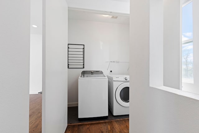 910 W 19th St Unit A, Houston, TX 77008 - laundry area featuring washer and clothes dryer, dark wood-type flooring, and healthy amount of natural light