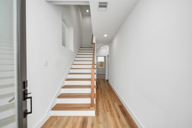 1218 English St, Houston, TX 77009 - staircase with wood finished floors, recessed lighting, and baseboards
