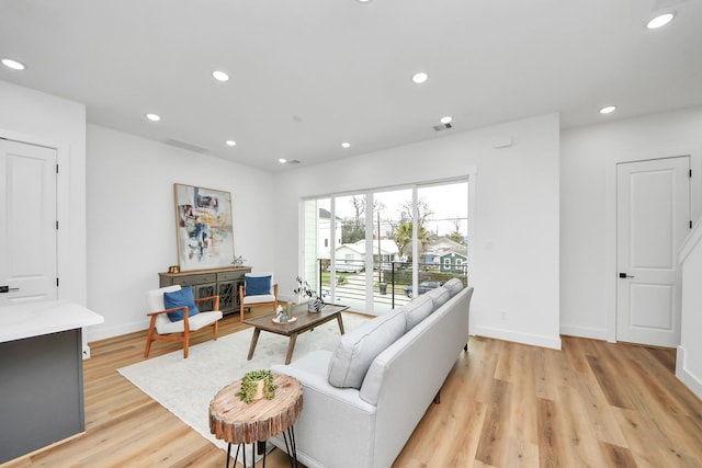 1218 English St, Houston, TX 77009 - living area with recessed lighting, light wood finished floors, and baseboards