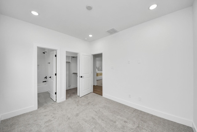 1218 English St, Houston, TX 77009 - unfurnished bedroom with carpet, baseboards, a walk in closet, recessed lighting, and ensuite bathroom