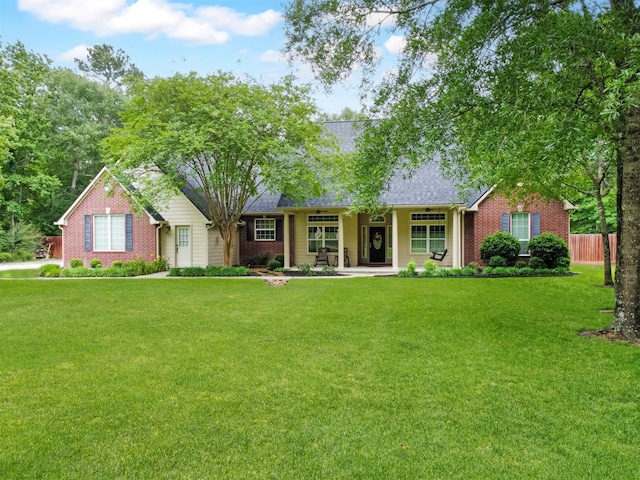 11987 White Oak Xing, Conroe, TX 77385 - ranch-style house featuring brick siding, a porch, and roof with shingles