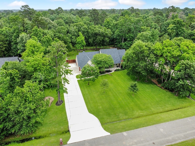 11987 White Oak Xing, Conroe, TX 77385 - aerial view of property and surrounding area with a heavily wooded area
