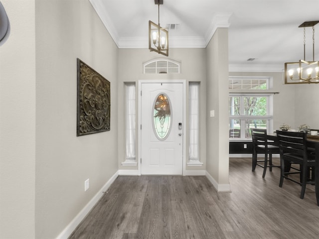 11987 White Oak Xing, Conroe, TX 77385 - entryway with a chandelier, crown molding, wood finished floors, and baseboards