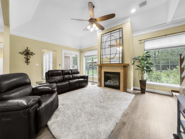 11987 White Oak Xing, Conroe, TX 77385 - living area with a ceiling fan, a glass covered fireplace, wood finished floors, baseboards, and recessed lighting