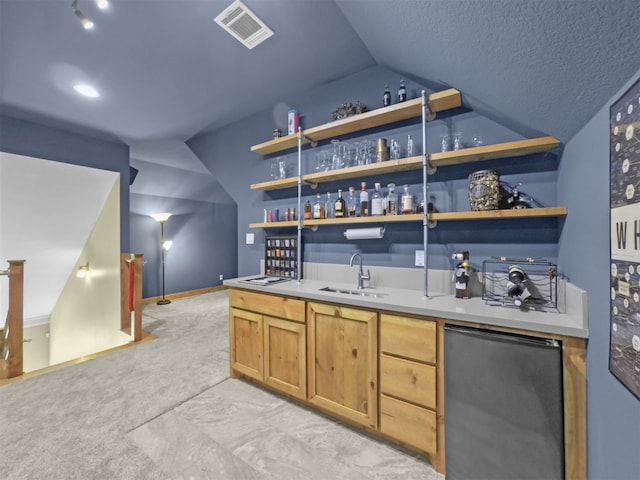 11987 White Oak Xing, Conroe, TX 77385 - indoor wet bar featuring refrigerator, vaulted ceiling, light colored carpet, baseboards, and a textured ceiling