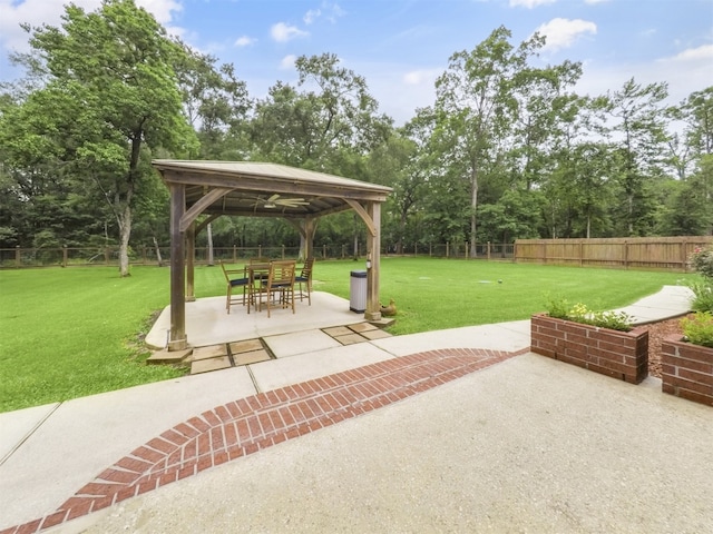 11987 White Oak Xing, Conroe, TX 77385 - view of patio / terrace with a gazebo and view of wooded area