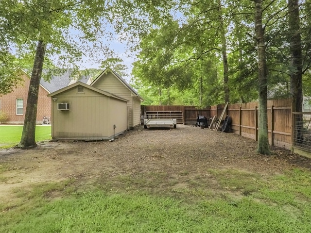 11987 White Oak Xing, Conroe, TX 77385 - back of house with fence, a wall mounted AC, and a wooden deck