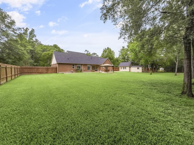 11987 White Oak Xing, Conroe, TX 77385 - view of yard featuring an outdoor structure