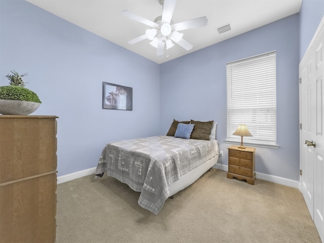 11987 White Oak Xing, Conroe, TX 77385 - carpeted bedroom featuring baseboards and a ceiling fan