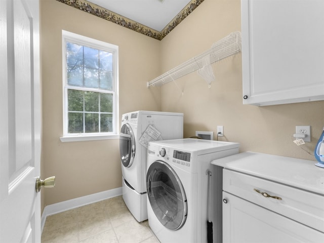 11987 White Oak Xing, Conroe, TX 77385 - laundry room with separate washer and dryer, cabinet space, and baseboards