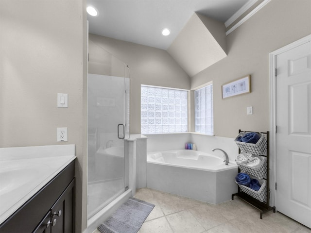 11987 White Oak Xing, Conroe, TX 77385 - bathroom with vanity, a stall shower, a garden tub, vaulted ceiling, and tile patterned floors