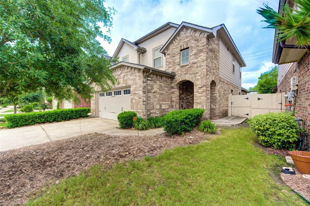 view of front facade featuring concrete driveway, brick siding, and a garage