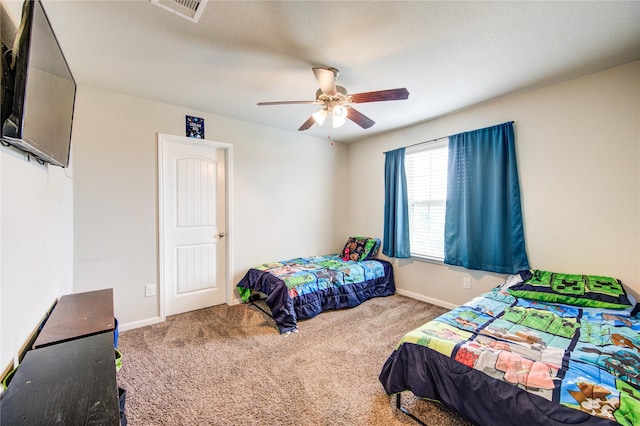 bedroom with carpet, baseboards, and ceiling fan