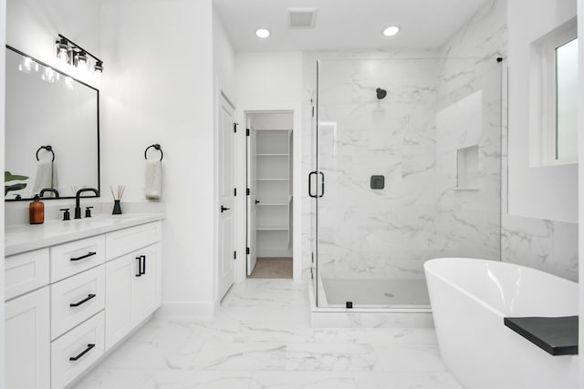4802 Elysian St Unit C, Houston, TX 77009 - bathroom featuring a marble finish shower, recessed lighting, vanity, marble finish flooring, and a freestanding tub