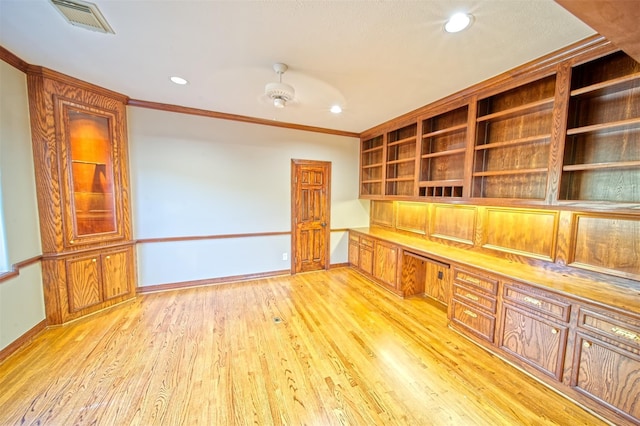 910 Peachwood Bend Dr, Houston, TX 77077 - unfurnished office featuring built in study area, ornamental molding, light wood-style floors, recessed lighting, and baseboards