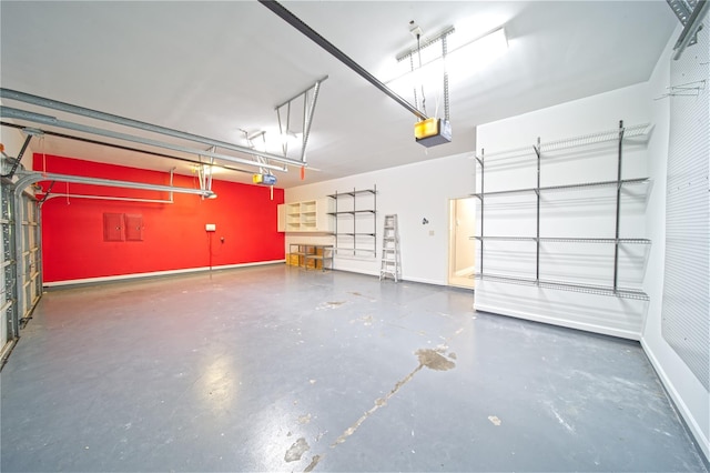 910 Peachwood Bend Dr, Houston, TX 77077 - garage featuring a garage door opener and baseboards