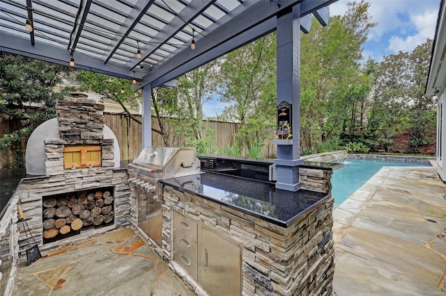 910 Peachwood Bend Dr, Houston, TX 77077 - view of patio / terrace with exterior kitchen, fence, a pergola, and a grill
