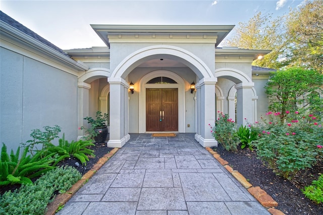 910 Peachwood Bend Dr, Houston, TX 77077 - doorway to property featuring stucco siding