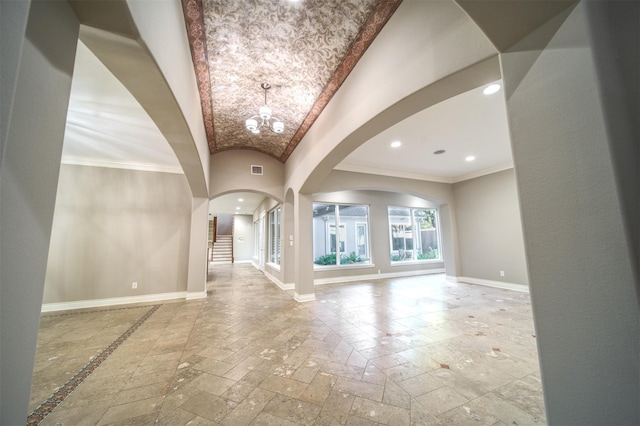 910 Peachwood Bend Dr, Houston, TX 77077 - foyer featuring arched walkways, baseboards, stone tile floors, a chandelier, and stairs