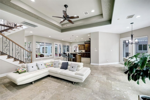 910 Peachwood Bend Dr, Houston, TX 77077 - living room with baseboards, stone tile flooring, recessed lighting, and stairway