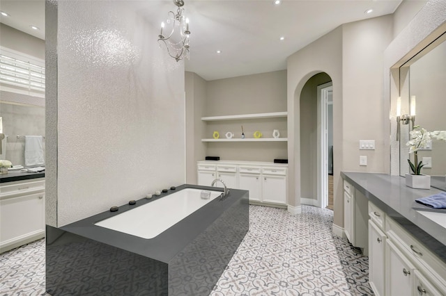 910 Peachwood Bend Dr, Houston, TX 77077 - full bath with built in features, recessed lighting, a bath, and baseboards