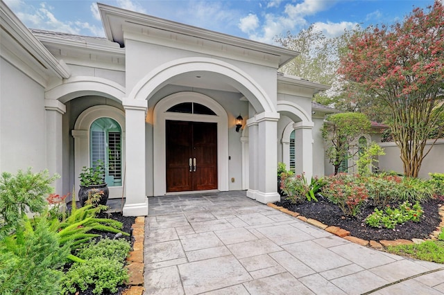 910 Peachwood Bend Dr, Houston, TX 77077 - doorway to property with stucco siding