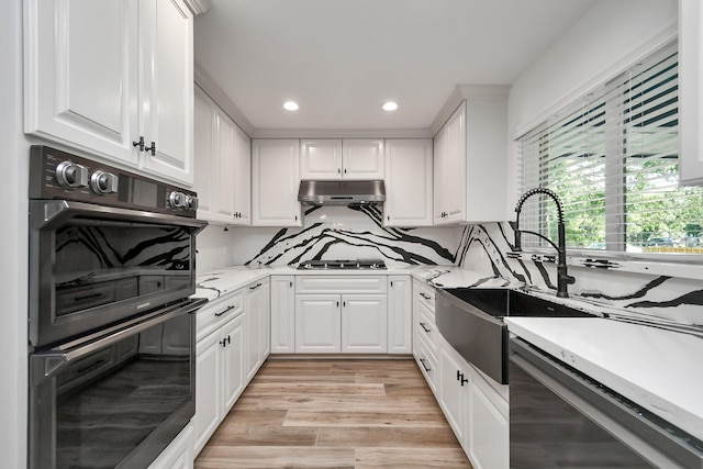 1805 E Ave, Katy, TX 77493 - kitchen featuring stainless steel gas stovetop, recessed lighting, light countertops, and white cabinets