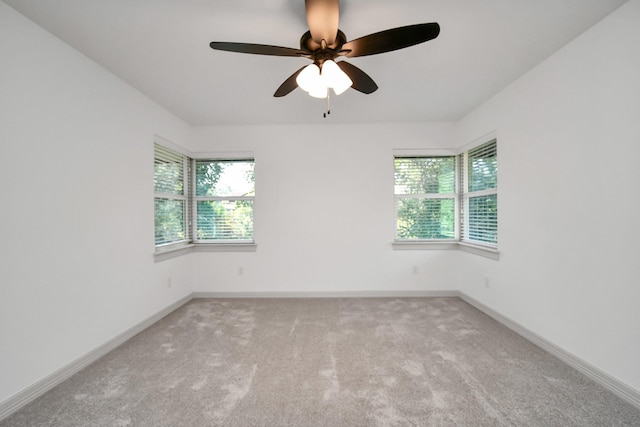 1805 E Ave, Katy, TX 77493 - spare room featuring plenty of natural light, carpet floors, ceiling fan, and baseboards