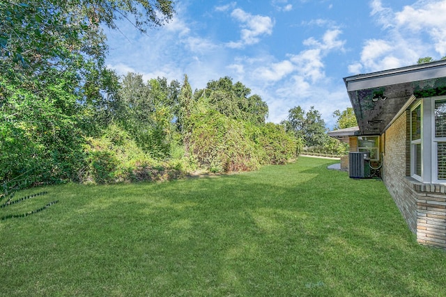 1805 E Ave, Katy, TX 77493 - view of green lawn with central AC unit