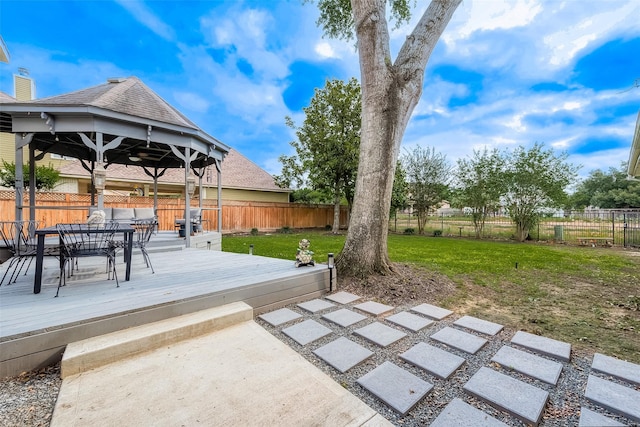 deck with a gazebo and outdoor dining space