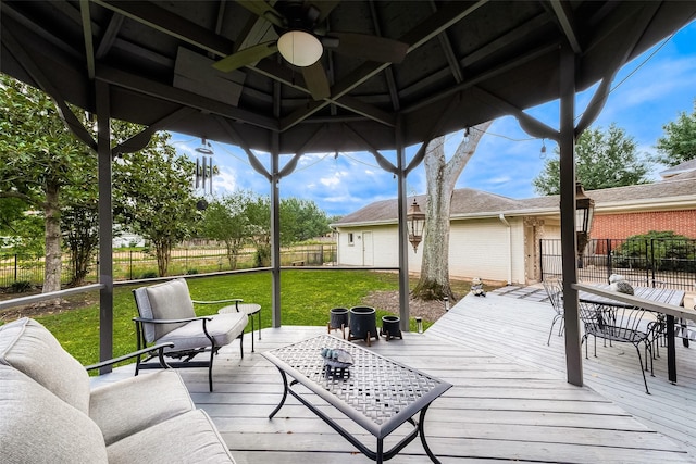 deck featuring ceiling fan and outdoor dining area