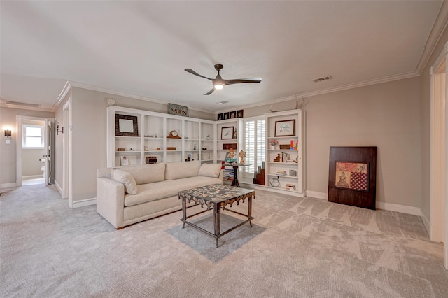 living room featuring crown molding, carpet floors, ceiling fan, and baseboards