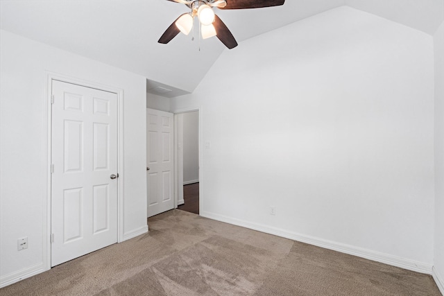 326 Lake Rim Dr, Rosenberg, TX 77469 - unfurnished bedroom featuring vaulted ceiling, carpet, ceiling fan, and baseboards