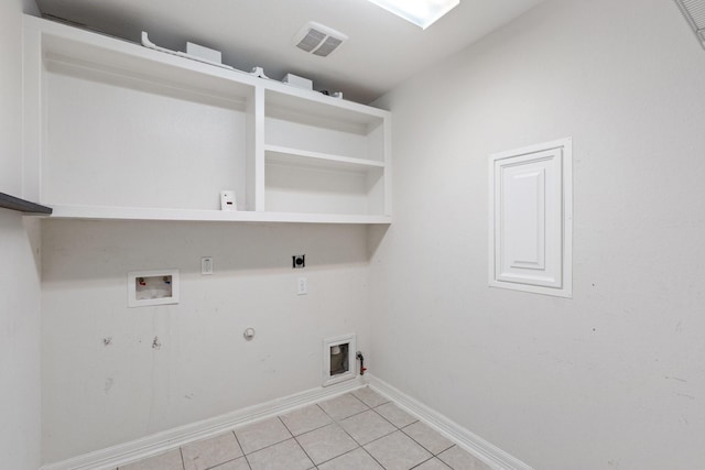 326 Lake Rim Dr, Rosenberg, TX 77469 - laundry room featuring hookup for a gas dryer, light tile patterned floors, washer hookup, baseboards, and electric dryer hookup
