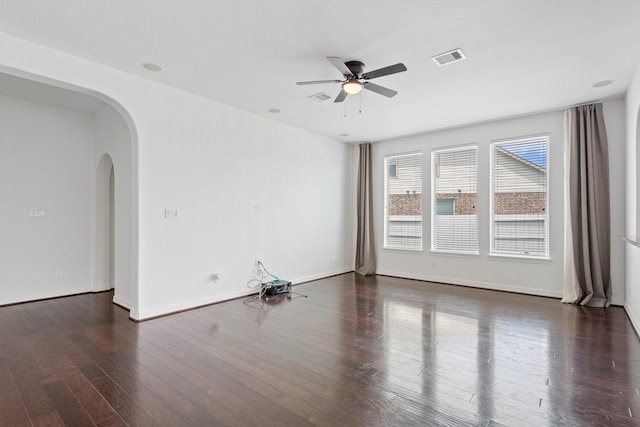 326 Lake Rim Dr, Rosenberg, TX 77469 - unfurnished room with arched walkways, ceiling fan, wood finished floors, and baseboards