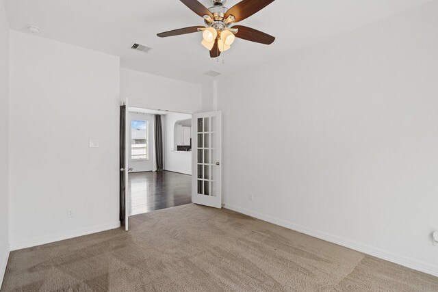 326 Lake Rim Dr, Rosenberg, TX 77469 - carpeted empty room with a ceiling fan, french doors, and baseboards