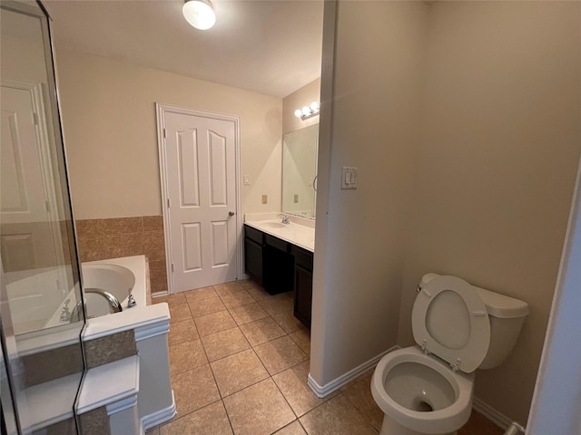 11317 Elegant Way, Houston, TX 77066 - full bath with tile patterned flooring, a bath, vanity, toilet, and baseboards