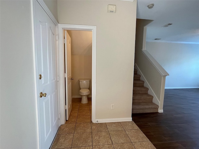 11317 Elegant Way, Houston, TX 77066 - stairway featuring crown molding, baseboards, and tile patterned floors