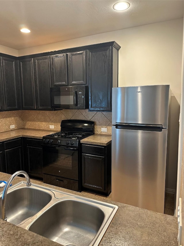 11317 Elegant Way, Houston, TX 77066 - kitchen featuring black appliances, dark cabinets, tasteful backsplash, a sink, and recessed lighting