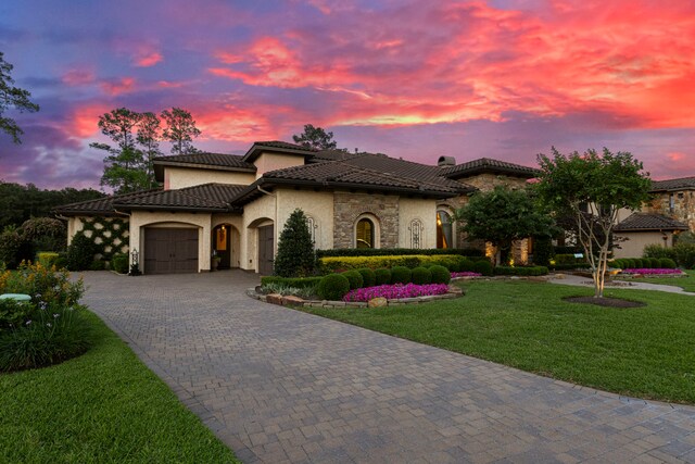 38 Post Shadow Estate Dr, Spring, TX 77389 - mediterranean / spanish-style home featuring an attached garage, decorative driveway, stucco siding, a tiled roof, and a front yard